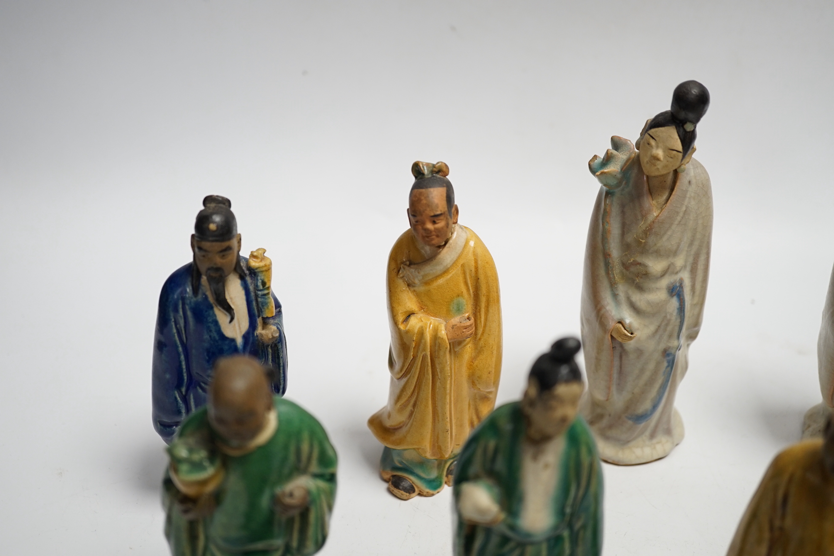 Fifteen Chinese Shiwan-type glazed pottery figures and carved stone figures, early 20th century, tallest 15cm